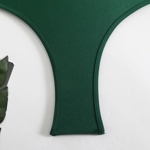 Dark green halter one-piece swimsuit with double-stitched fabric detail and silky texture