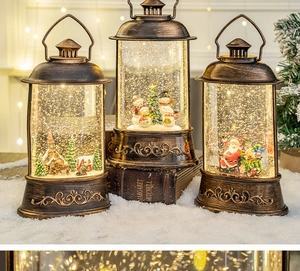 Close-up of vintage bronze Christmas lanterns with glitter snow and holiday scenes