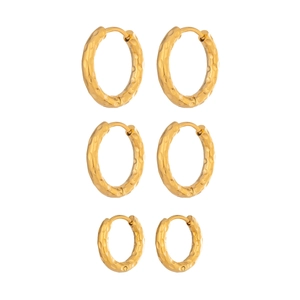 Three pairs of golden hammered stainless steel hoop earrings in varying sizes
