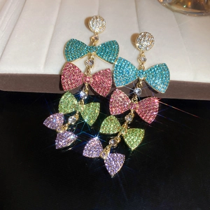 Luxury long tassel earrings featuring multicolor rhinestone bow ties with gold finish