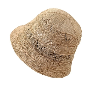 Women's foldable knit bucket hat with hollow pattern and bow tie in beige