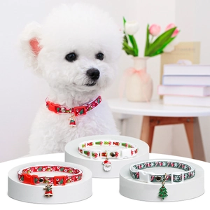 Christmas pet collar set with Santa charms for dogs and cats on a tiered display