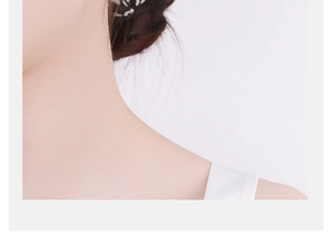Elegant lifestyle shot showing minimalist flower stud earring worn on a female model's ear