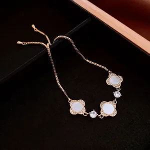 Rose gold plated flower clover bracelet with white zircons and adjustable pull chain closure