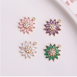Detailed view of colorful sunflower pendants featuring zircon marquise petals and gold plating