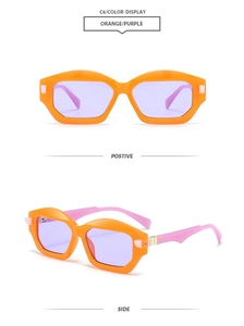Detail view of orange geometric sunglasses with purple lenses and metal hinges