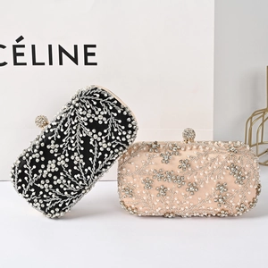 Luxury rhinestone evening clutch bag with pearls in black and champagne gold satin