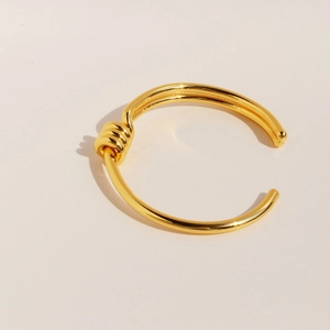 Minimalist double-layered gold knotted open cuff bracelet for women in polished brass