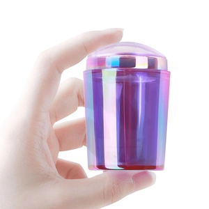 Iridescent cylindrical French nail stamper with holographic finish and clear silicone top