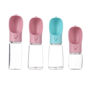 Portable pet water bottles in pink and blue colors for dogs and cats on white background