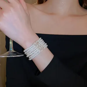 Elegant multi-layer pearl bracelet with a rectangular crystal-set buckle for women