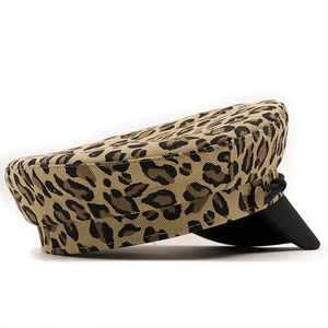 Chic leopard print cotton baker boy hat with black rope trim and vintage metal buttons