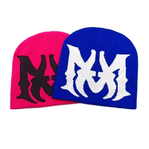 Knitted beanies in blue and rose red featuring gothic jacquard letter patterns