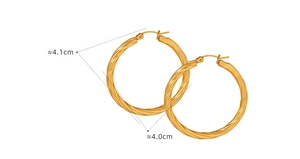 Detail of large gold hoop earrings with twisted texture and 4cm diameter measurement