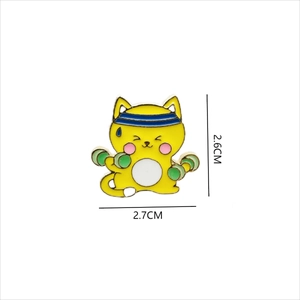 Detailed view of yellow cartoon cat fitness pin with size dimensions 2.7cm by 2.6cm