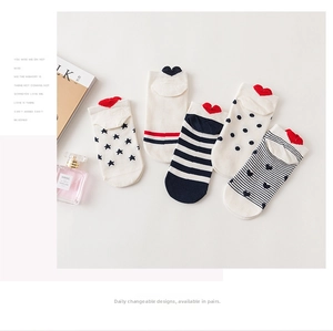 Detail of five pairs of patterned ankle socks with 3D heart patches on heels