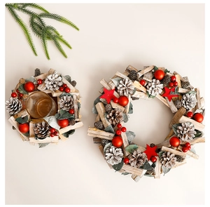 Detailed top view of Christmas wreath and wooden candle holder with pine cones and berries