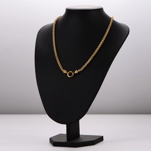18k gold plated hollow basket pendant necklace displayed on a black neck bust