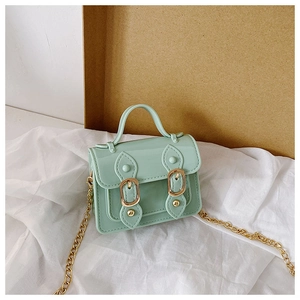 Front view of mint green glossy crossbody bag with gold chain and buckle details