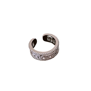 Elegant silver open ring with pavé-set zircons in a minimalist luxury style design