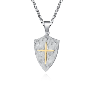 Silver shield pendant necklace with vintage bark texture and gold cross on box chain