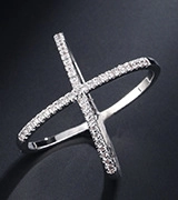 Macro shot of silver-tone criss-cross X ring with pave-set shimmering zircon stones