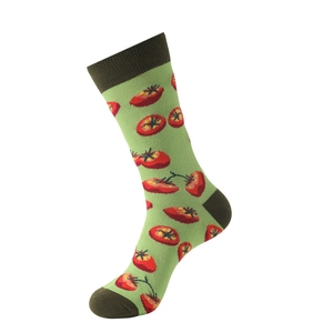 Detail of green mid-calf sock featuring red tomato print and dark brown toe and heel parts