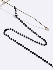 Detail of black pearl glasses chain with silver lobster clasps and silicone loops