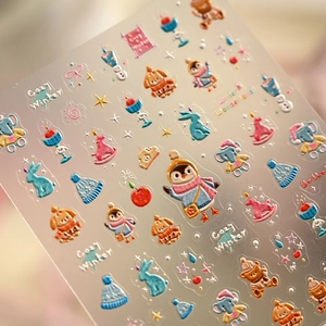 3D embossed winter nail stickers featuring cute cartoon animals and cozy snow patterns