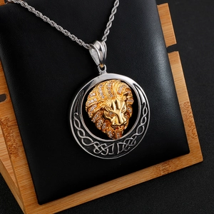 Close-up of gold lion head pendant with diamonds in silver hollow frame and twist chain
