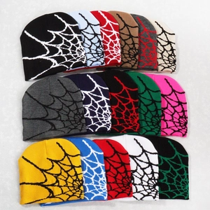 Flat lay grid showing various colors of Y2K spider web jacquard knitted beanies
