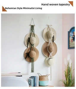 Detail of bohemian hand-woven wall tapestry for hat storage in olive and beige cotton
