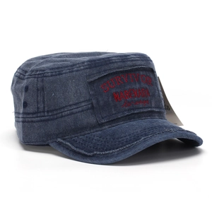 Detail view of washed denim flat top cap with red Survivor embroidery and distressed brim