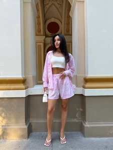 Detailed view of pink floral print long sleeve shirt and matching shorts set for women