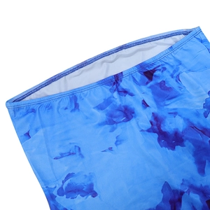 Detailed close-up of blue tie-dye print fabric and white lining with double stitching