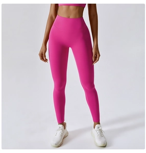 Detail of rose pink high waisted yoga pants with seamless texture and push up effect