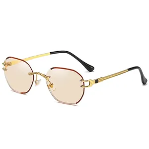 Fashion rimless sunglasses with light brown lenses and gold engraved metal temples