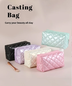 Quilted nylon makeup bags in five colors showing rhombic texture and zipper detail