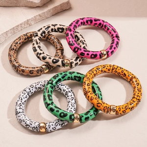 Bohemian acrylic leopard print tube bracelets with polished gold metal spacers