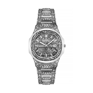 Detail of silver steel watch with intricate Arabic style engravings and date window