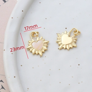 Macro detail of 14k gold heart shell pendant with 17x23mm size dimensions shown
