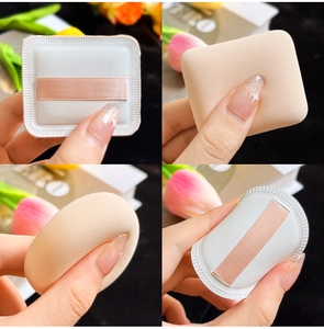 Macro shot showing round and square makeup sponges with soft pink ribbons and flexible texture