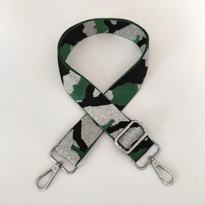 Adjustable camouflage bag strap with silver metal buckles on a clean white background