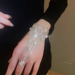 Detail of silver rhinestone ring bracelet combo showing shiny crystals on hand