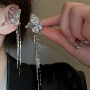 Detail of silver butterfly ear cuff with sparkling zircon fringe and tassels