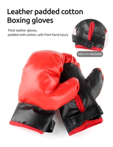 Detail of red and black boxing gloves with leather padded cotton and adjustable Velcro straps