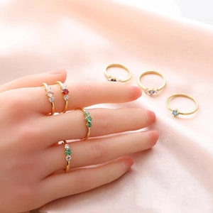 Retro titanium steel gold rings with colorful round and heart-shaped crystals on pink silk