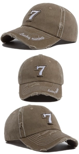 Detail showing vintage washed khaki baseball cap with number 7 embroidery and distressed brim