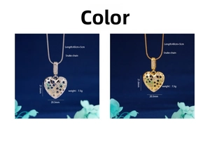 Detail of heart-shaped hollow pendant necklace with star patterns and snake chain