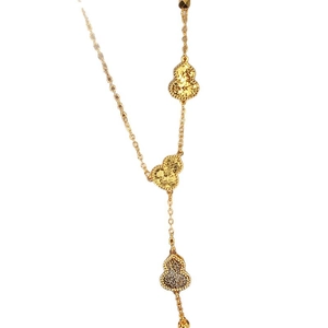 Elegant 18k gold plated necklace featuring three textured gourd pendants on a white background